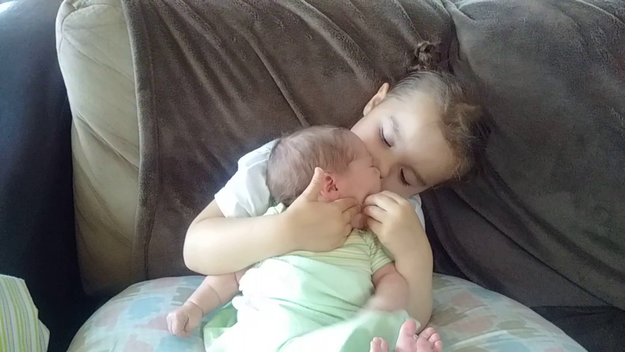 Mauling my baby brother with kisses