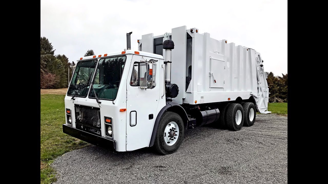 2006 Mack LE613 with 25 yd. Heil Split Body Rear Loader Garbage Truck