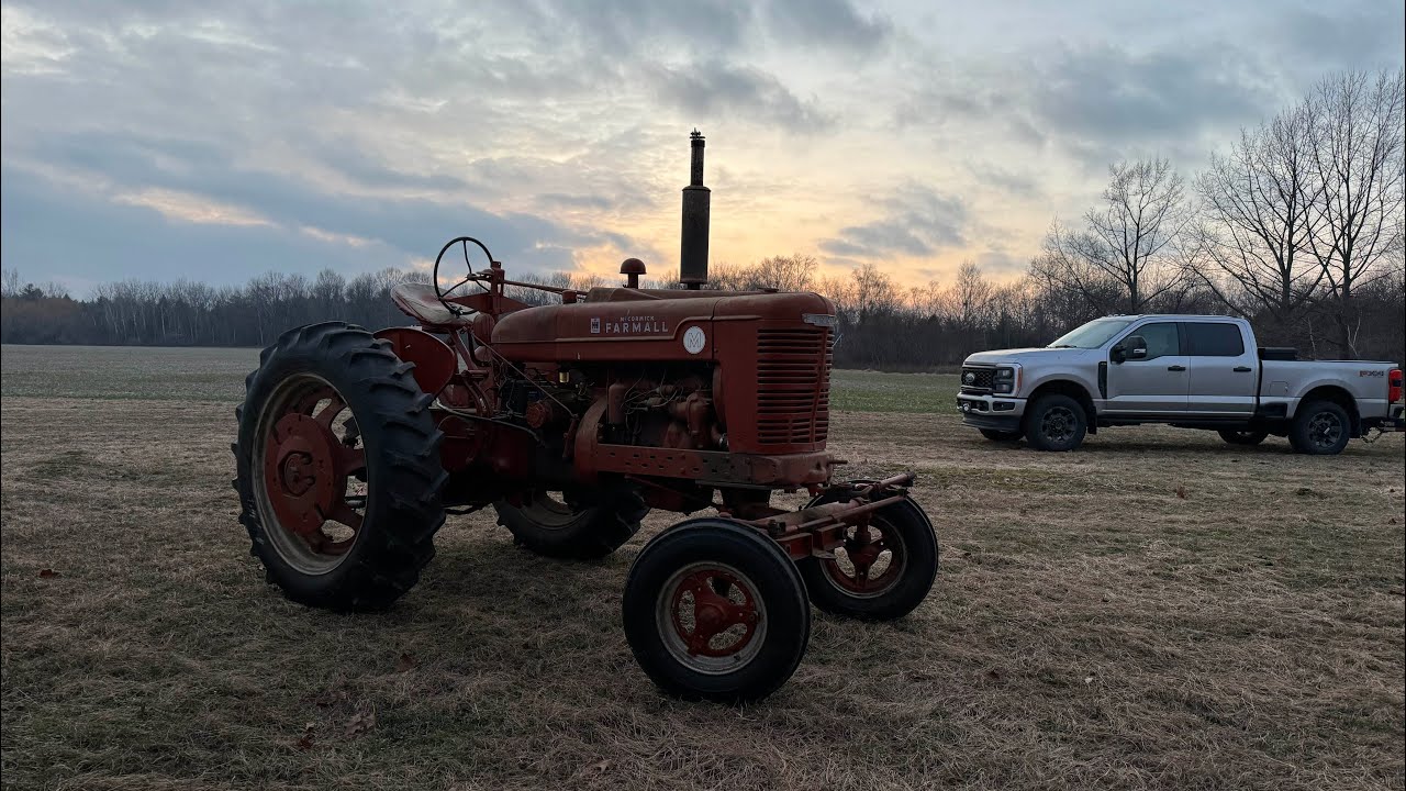 1950 Farmall M. Picking up my new hay tractor with a Ford 7.3 and driving it in the field
