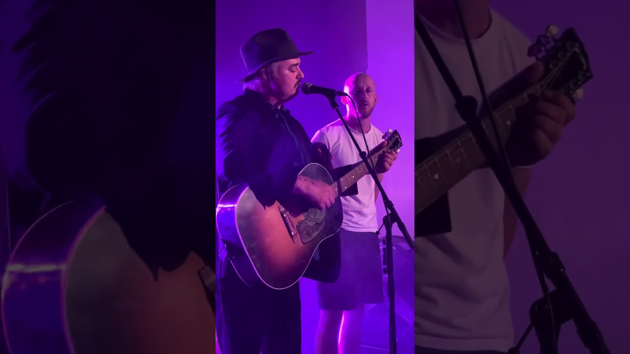 Peter Doherty invites an audience member to join him on stage to perform in  Liverpool