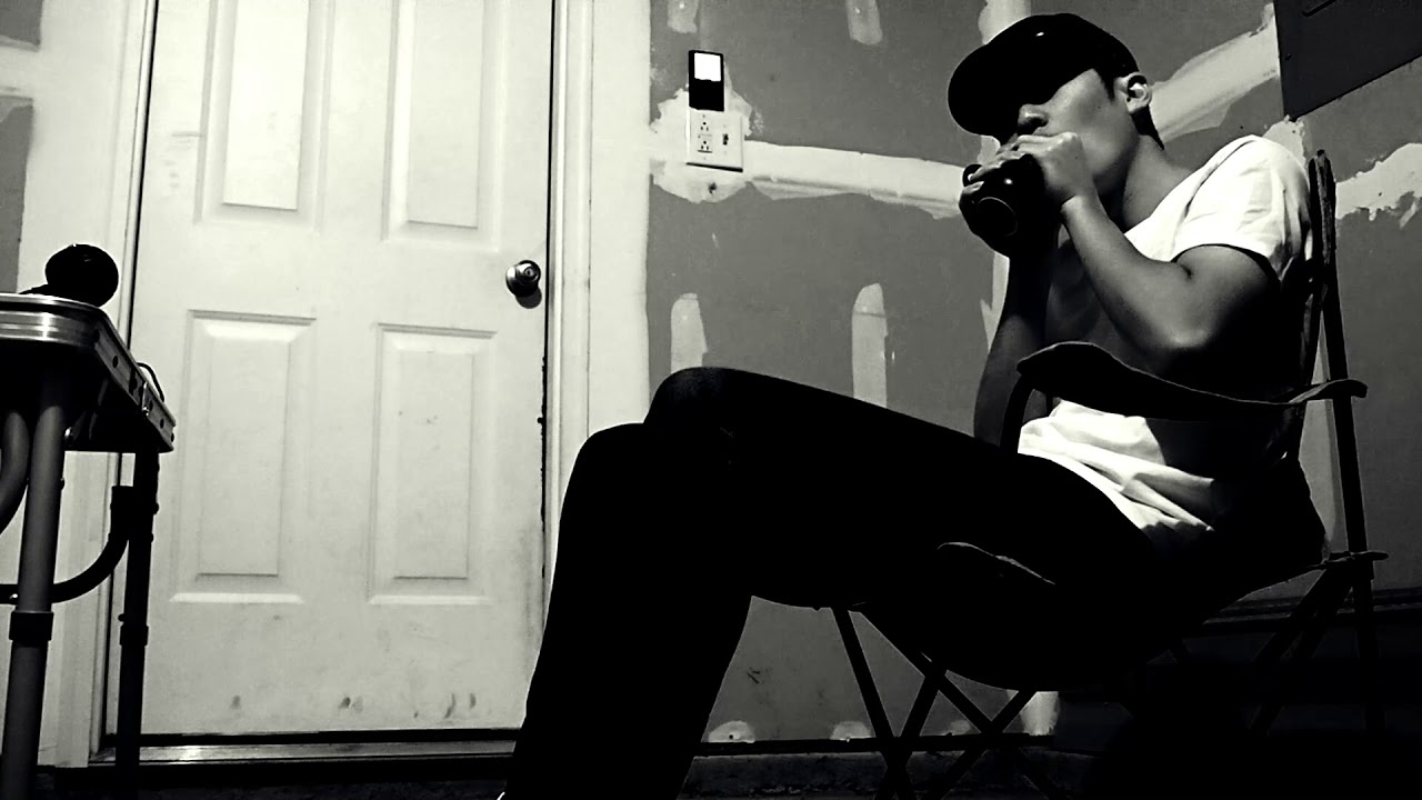 Playing harmonica with mug