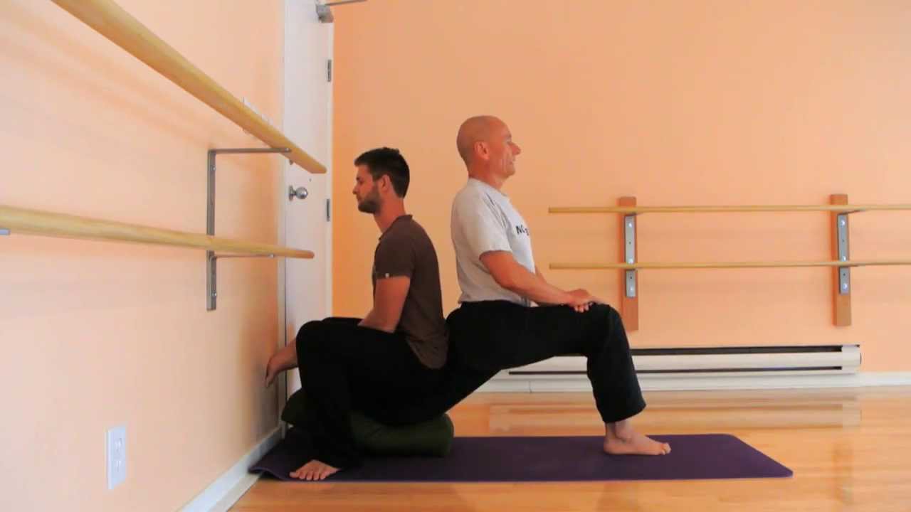 Wall quadriceps-hip flexor stretch; solo and partner versions | Stretch Therapy