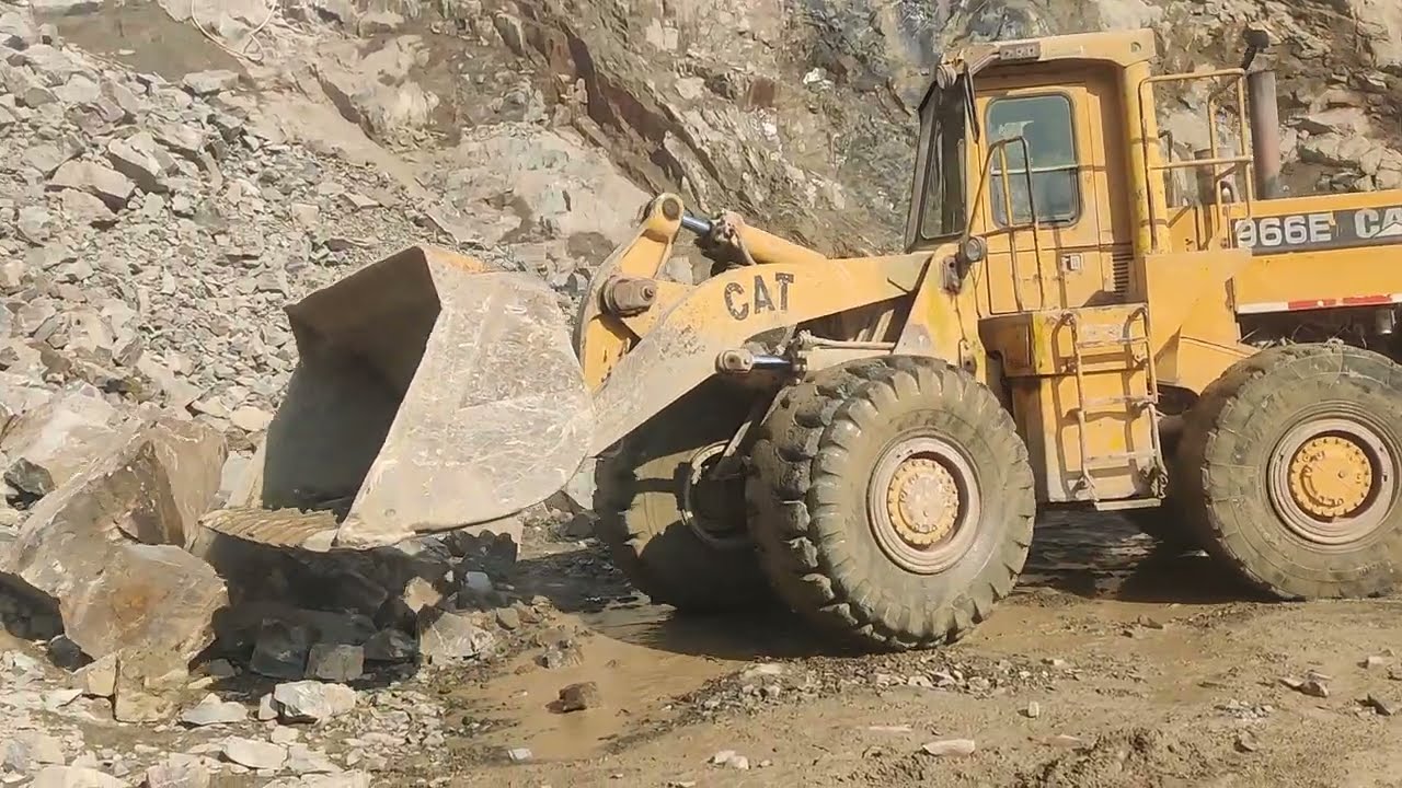 Big Caterpillar Loader Loading Stones into Dumper | Mountain Work