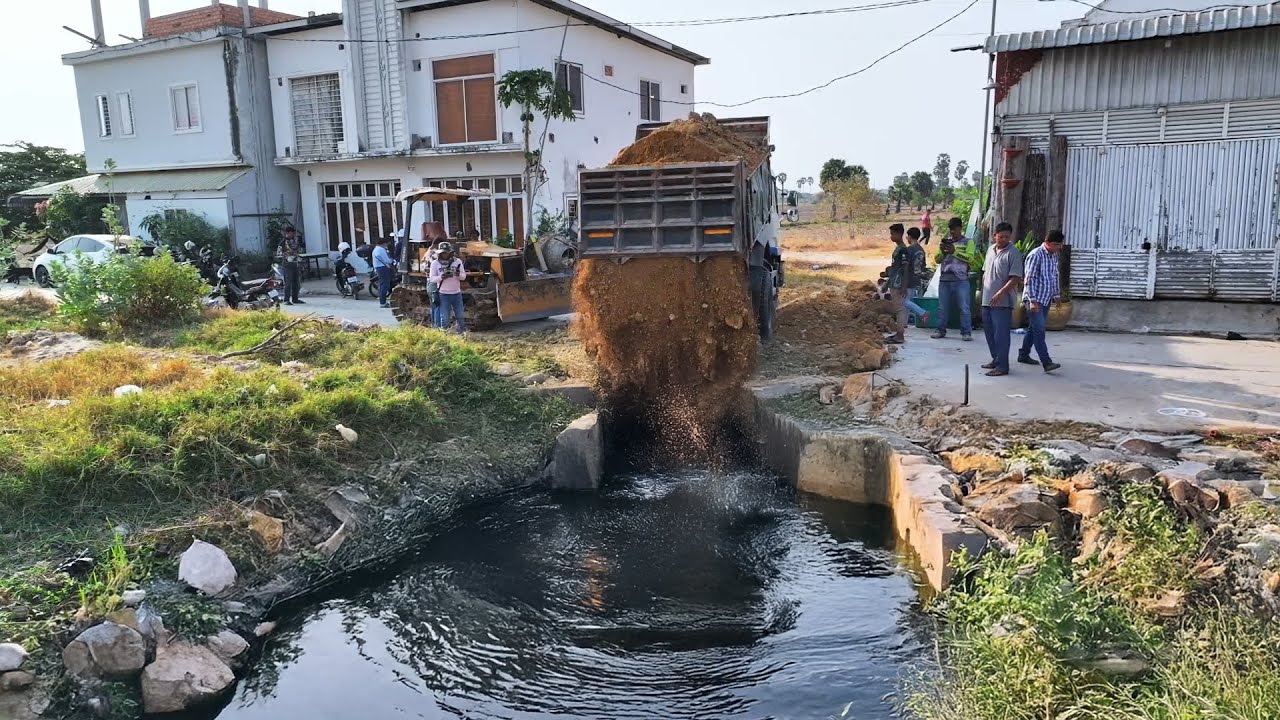 Action Building Road of Deep pond From Bulldozer Move Ston & Dump Trucks loading