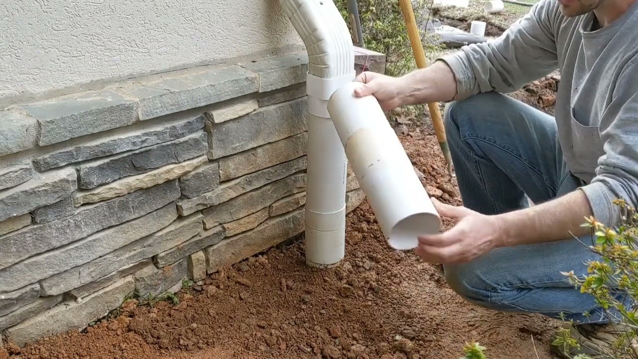 Gutter downspout quick and easy disconnect to PVC ground pipe.