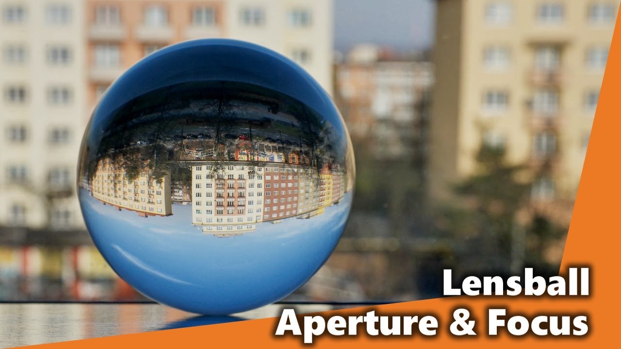 How do different apertures and focus points change the LENSBALL image?