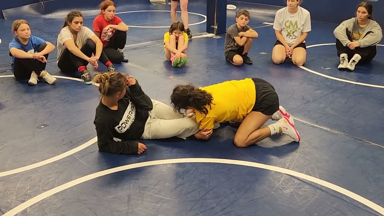 Ankle pick to leg lace off of takedown in freestyle wrestling