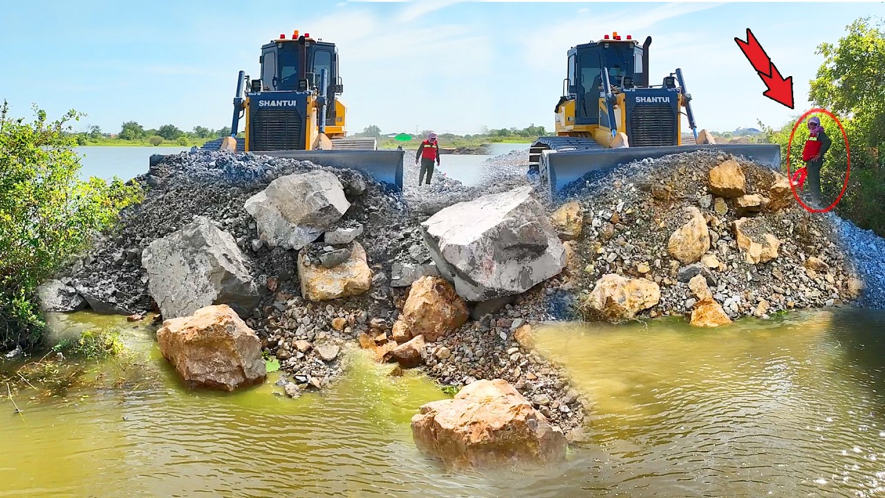 Nice Great activity developing new road on the Big Lake, achieving 70% & SHANTUI Dozer pushing rocks