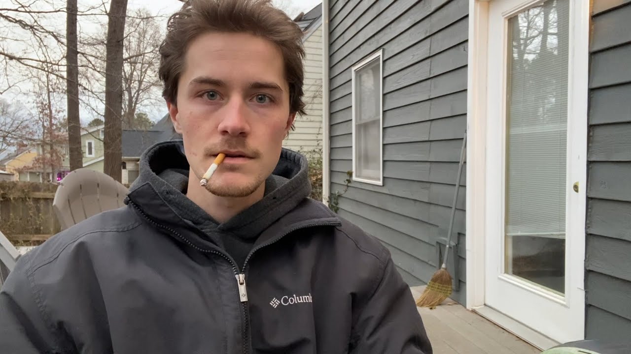 Smoking a Cigarette While Recording a Video About Smoking a Cigarette