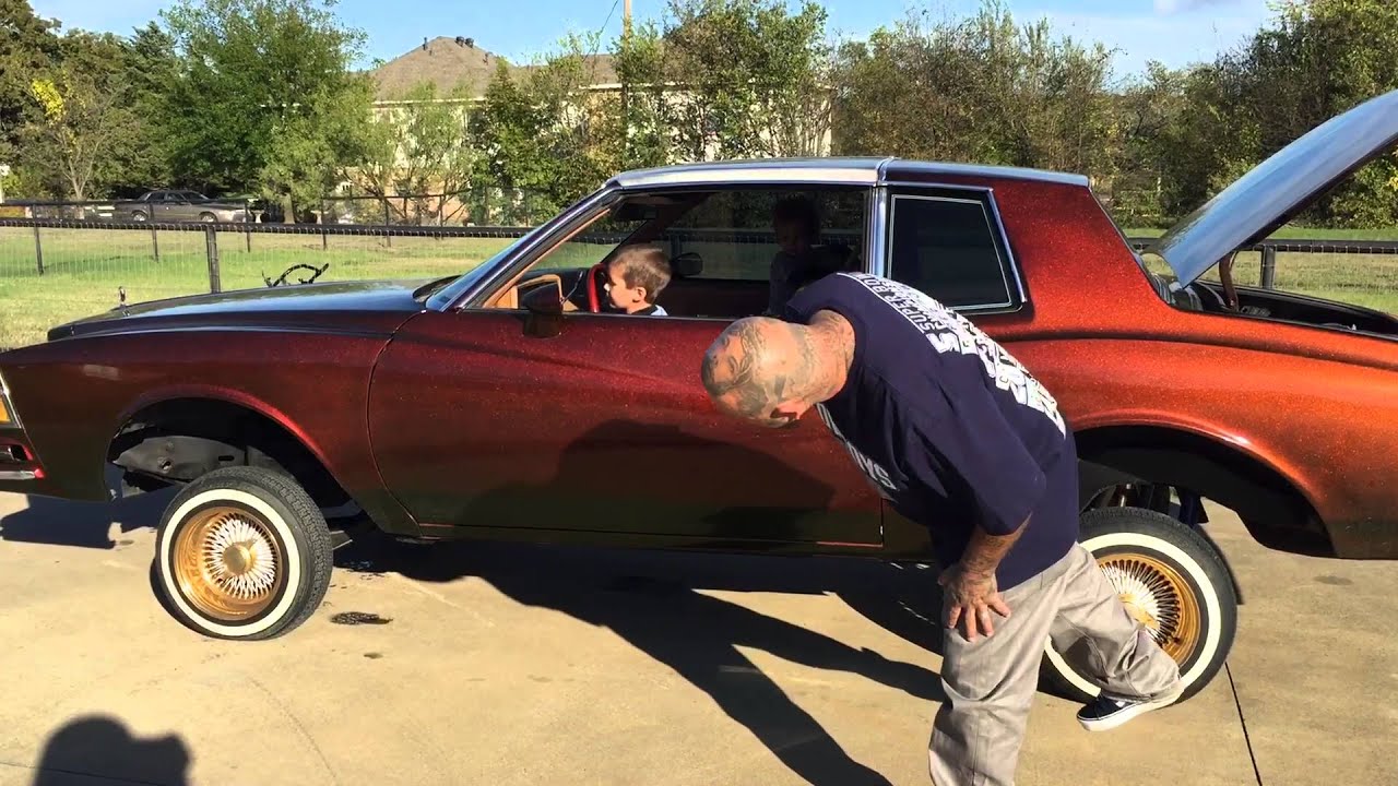 Kids hitting switches in the low rider Monte Carlo