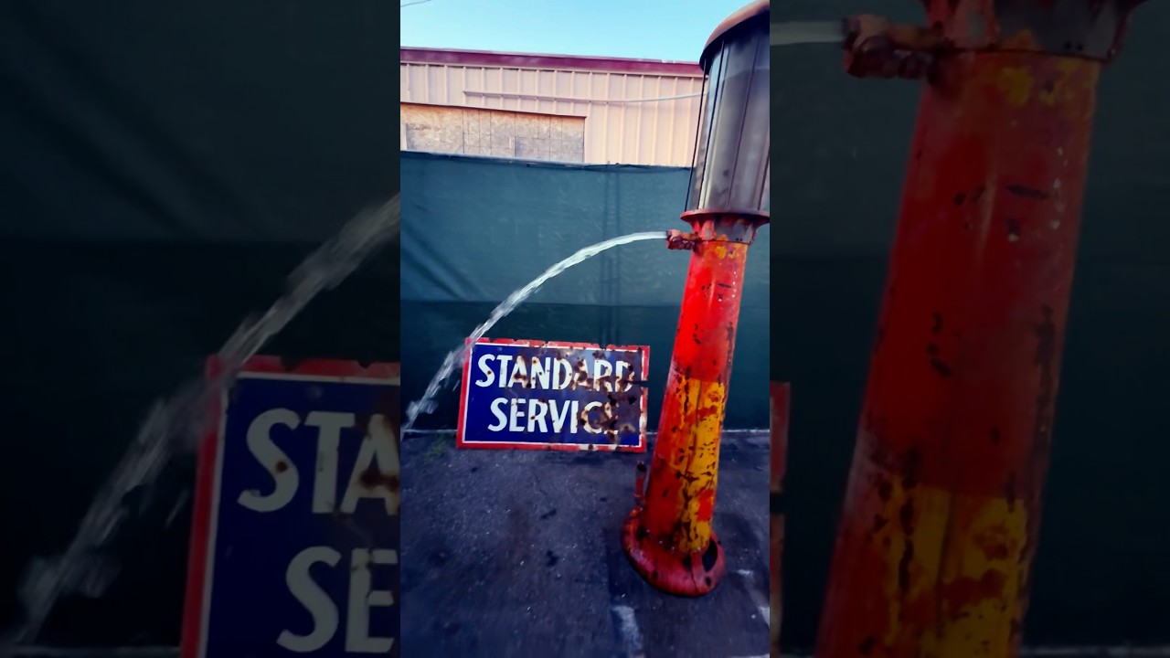 1920s Visible Gas Pump Flowing Liquid Rapidly 