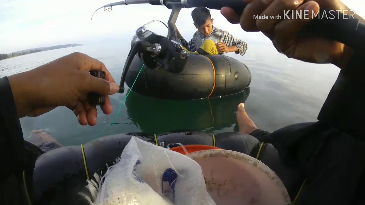 A kid, but he's a good fisherman! Using a used car inner tube. Part 2