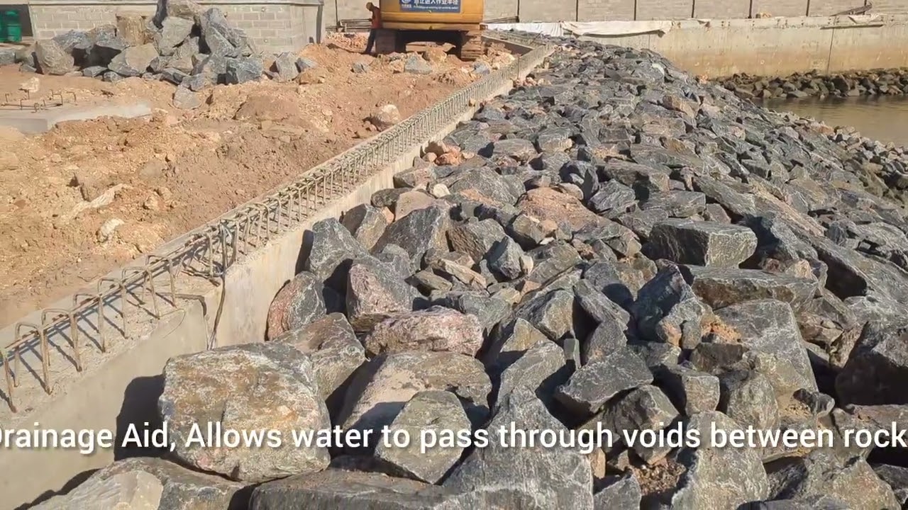 ROCK ARMOUR (RIPRAP) PROTECTION OF RETAINING WALL (REVETMENT)