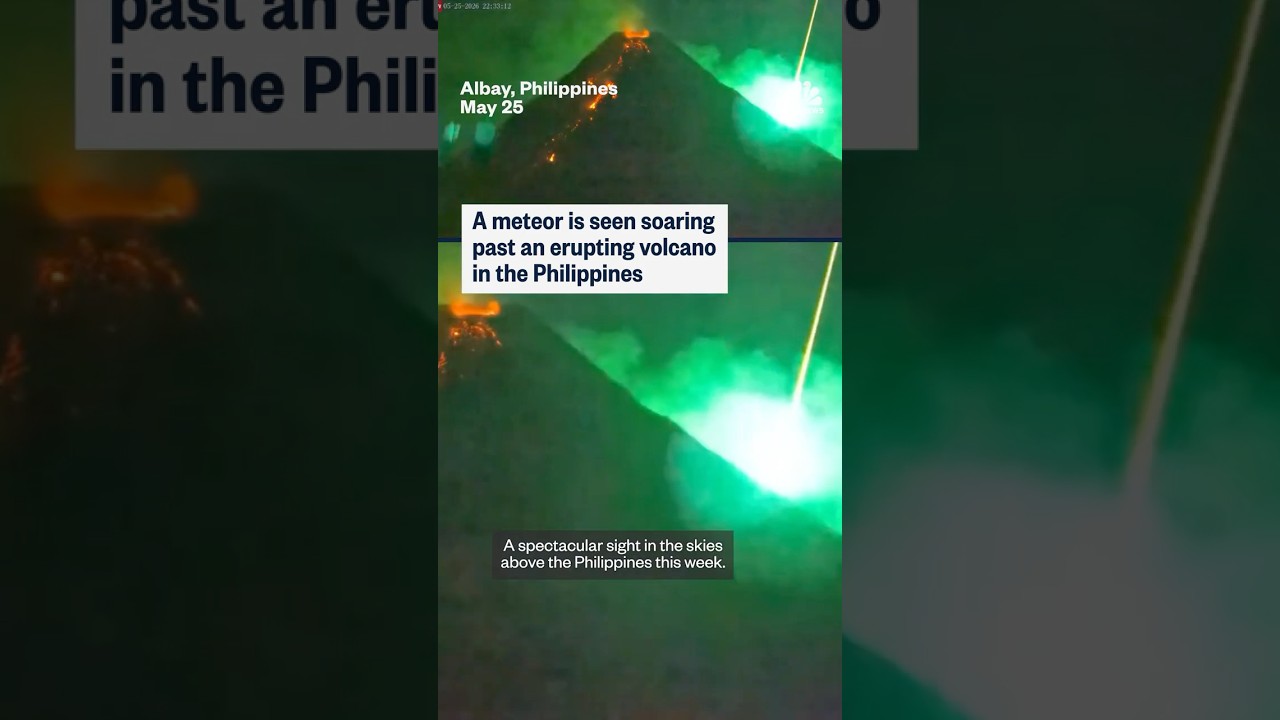 A meteor is seen soaring past an erupting volcano in the Philippines