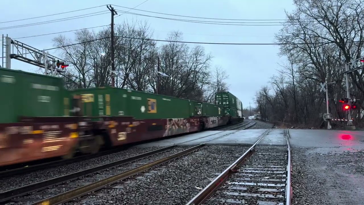 NS 9976 Dash9 leads NS 23G with a friendly crew at Piscataway  