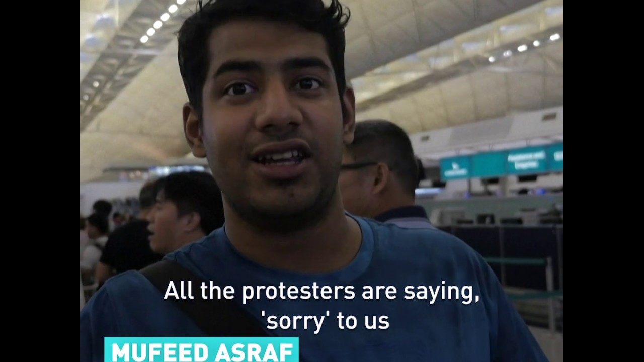 Travelers inside Hong Kong Airport on the protests