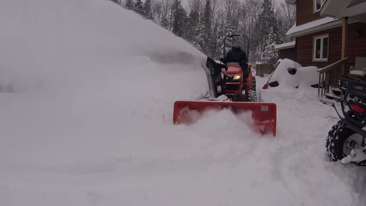 #25 Kubota B2601 Compact Tractor. Snow!! Tractor snowblower clearing the driveway. outdoor channel.