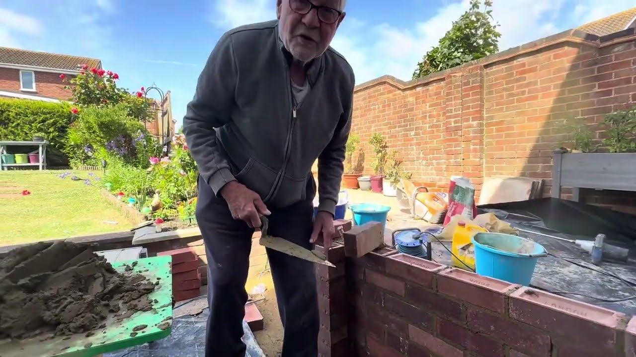 Brick wall and step with the old bricklayer