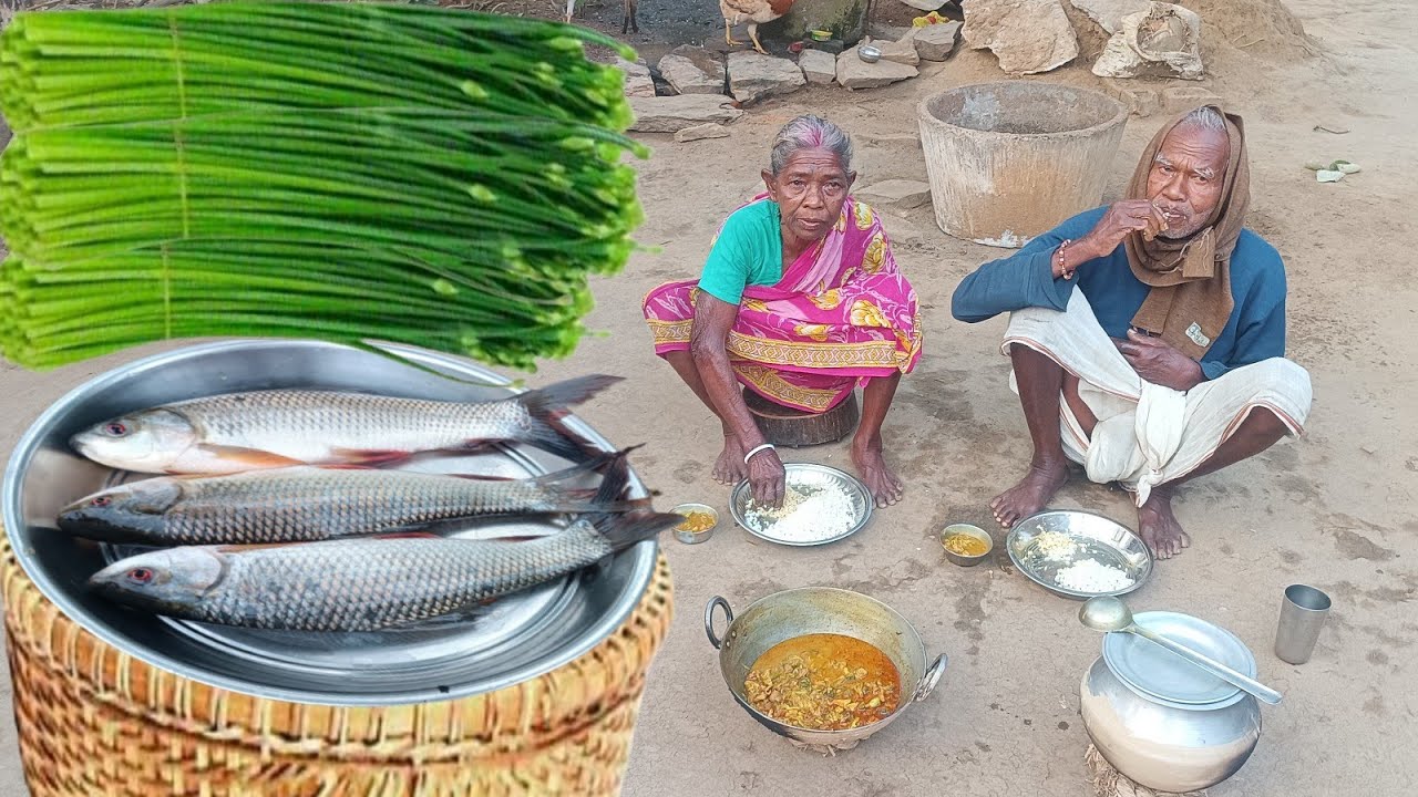 old tribe traditional cooking FISH CURRY with onion flowers Prepared by village Grandma cook||