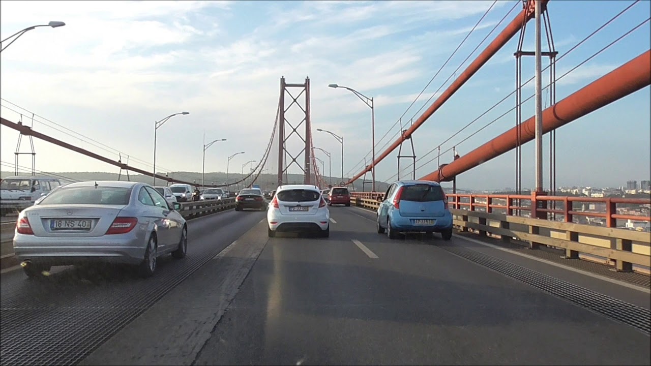 Driving on Ponte 25 de Abril bridge in Portugal