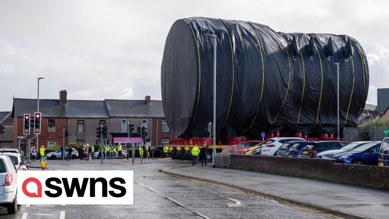 Incredible scenes show Royal Navy's new nuclear submarine moved along UK streets | SWNS