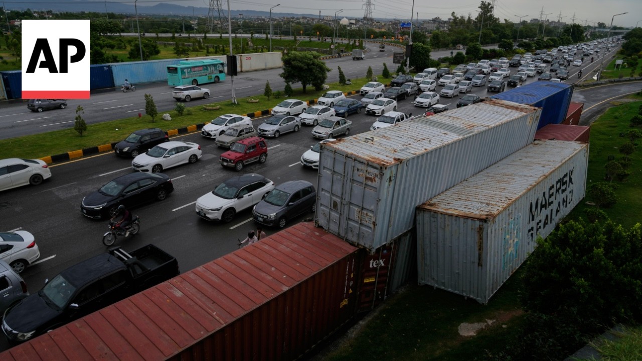 Shipping containers are used to block streets during protests in Islamabad