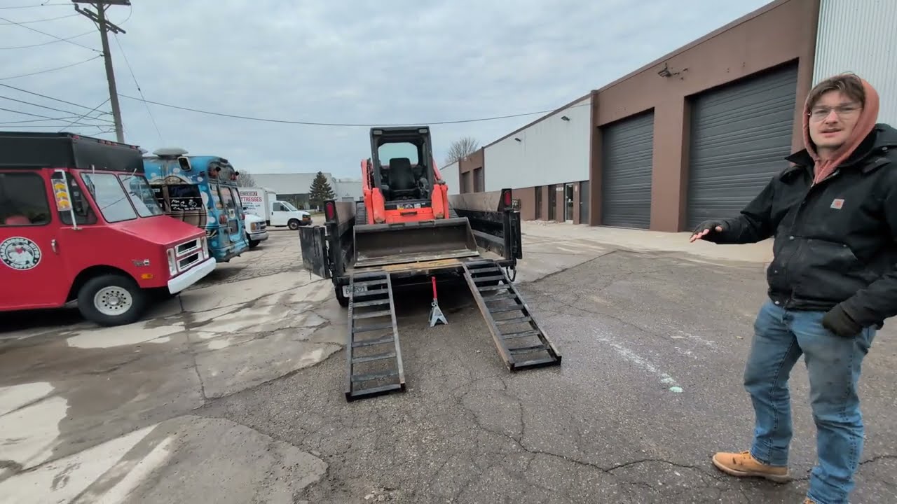 how to load a track loader into a dump trailer?