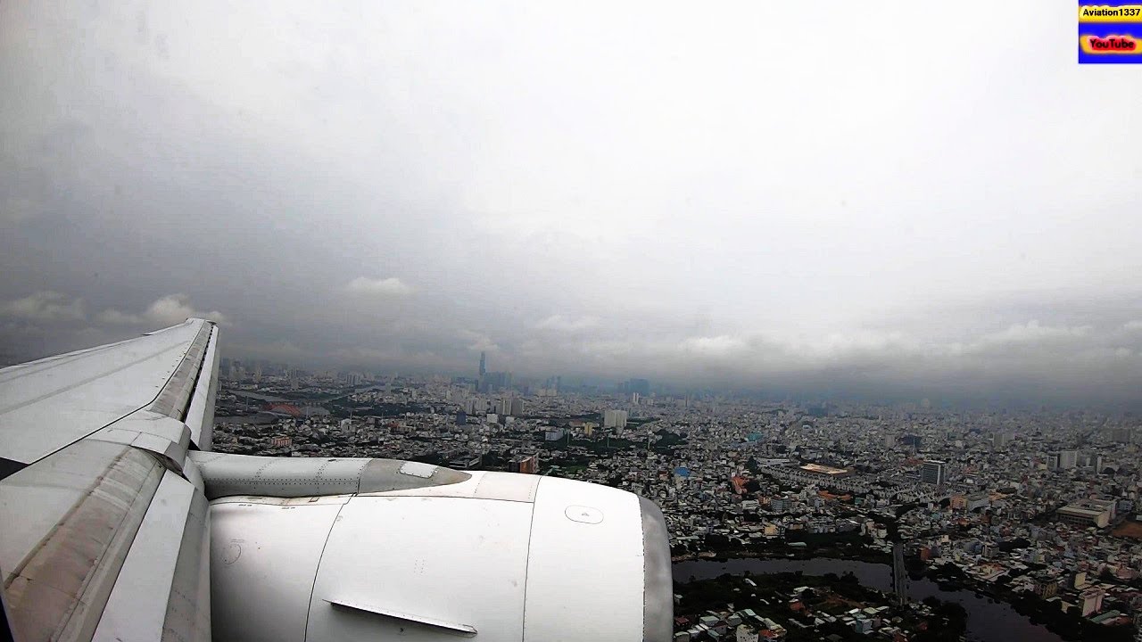 EVA AIR B777 LANDING IN A CLOUDY HO CHI MINH CITY - SAIGON - VIETNAM