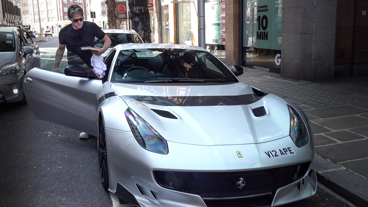 Hugh Grant driving his Ferrari F12 TDF in London!!