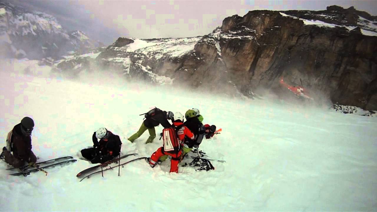 Swiss REGA ( helicopter ) snow rescue in Engelberg after knee injury