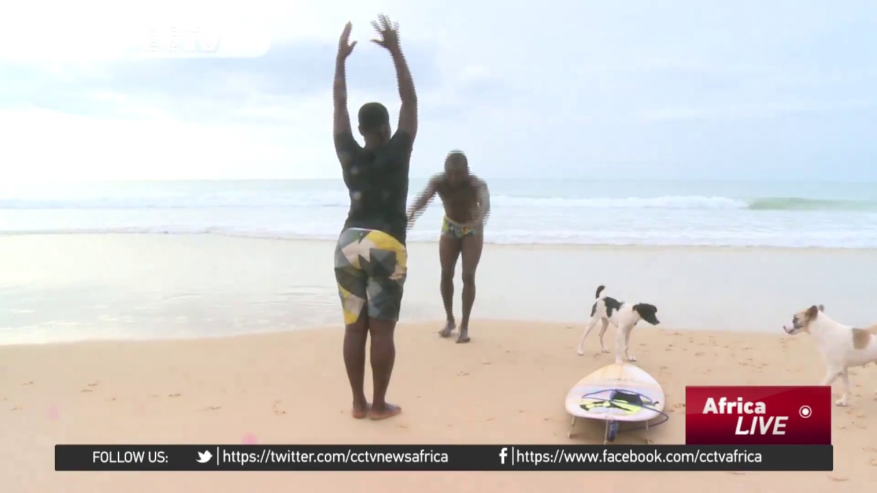 Young Sierra Leonean woman defies tradition, takes up surfing, a male-dominated sport