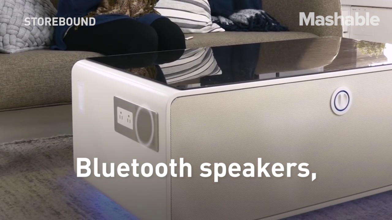 This coffee table comes with bluetooth and a fridge