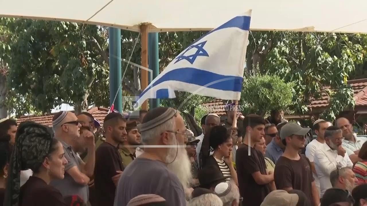 Family and friends attend funeral of Israeli soldier killed along with six other soldiers in Gaza
