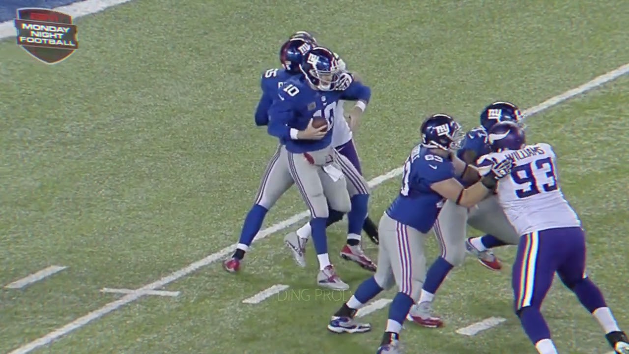 Jared Allen sacks Eli Manning with his teammate