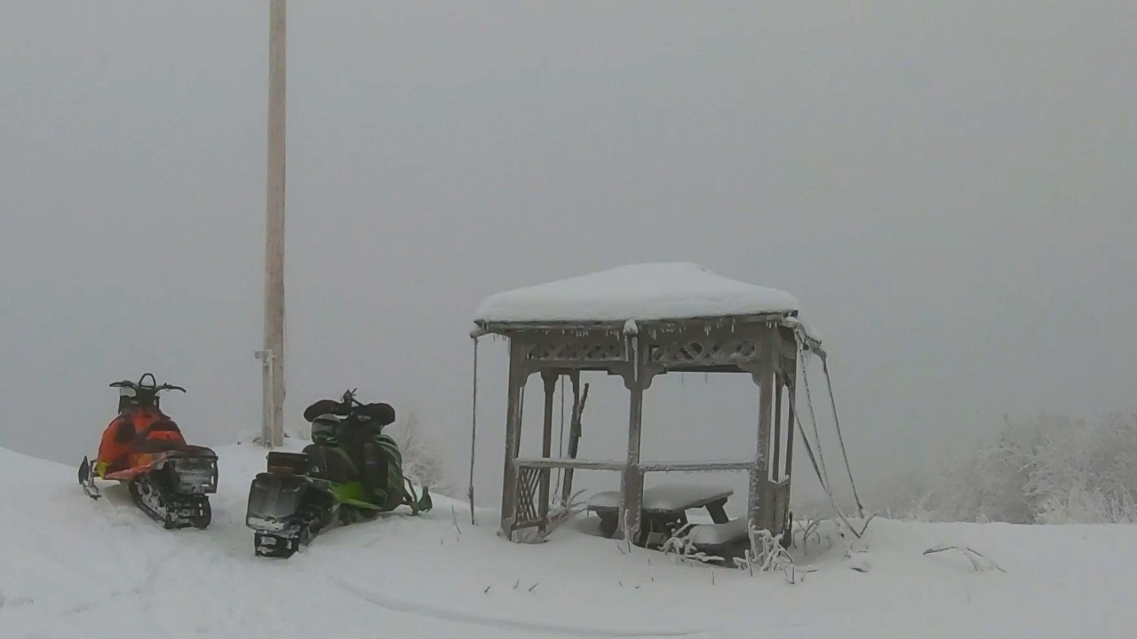 Lunch break in the clouds | NH Snowmobiling