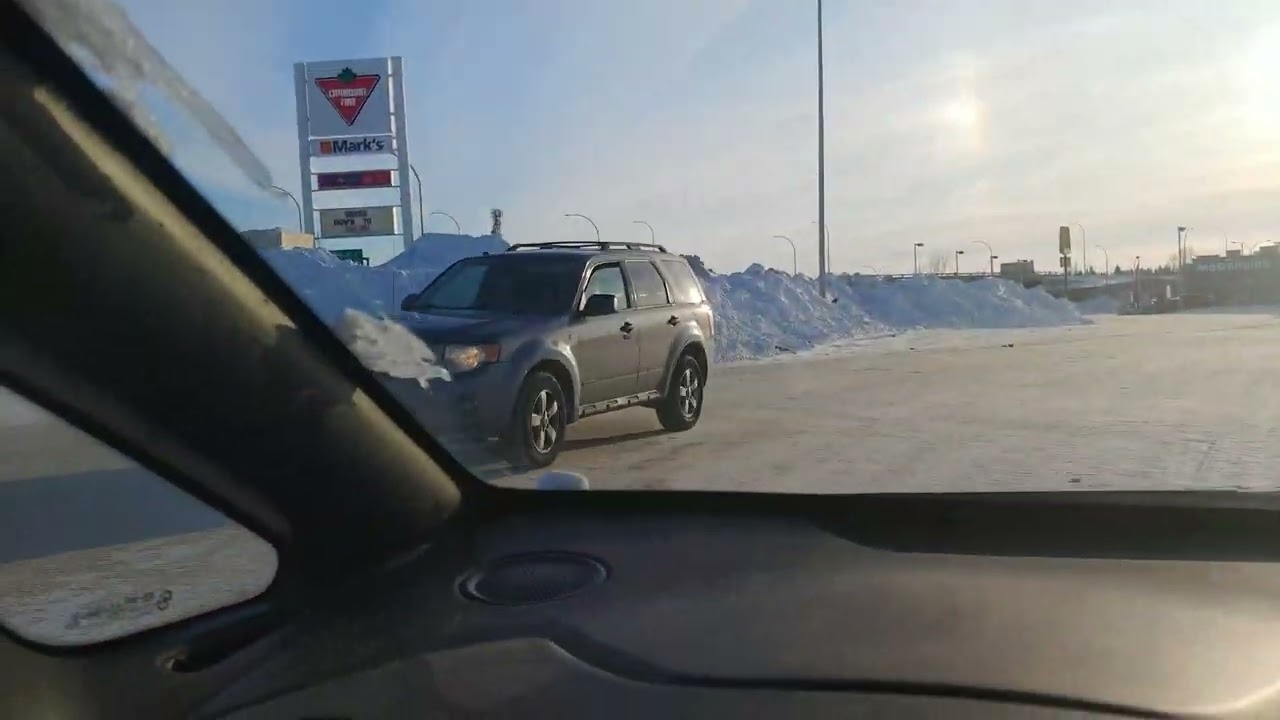 A snow filled parking lot in sunny Saskatoon.