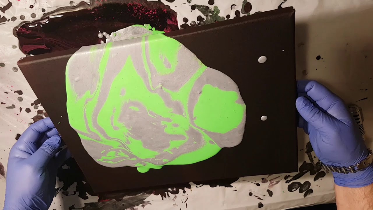 Acrylic pour painting with baby oil and coconut oil.