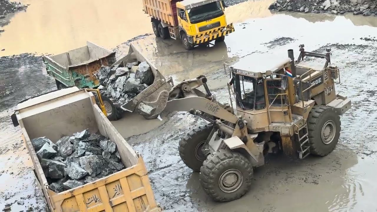 Caterpillar 966E Loader Loading Massive Rocks into Truck | Heavy Equipment in Action