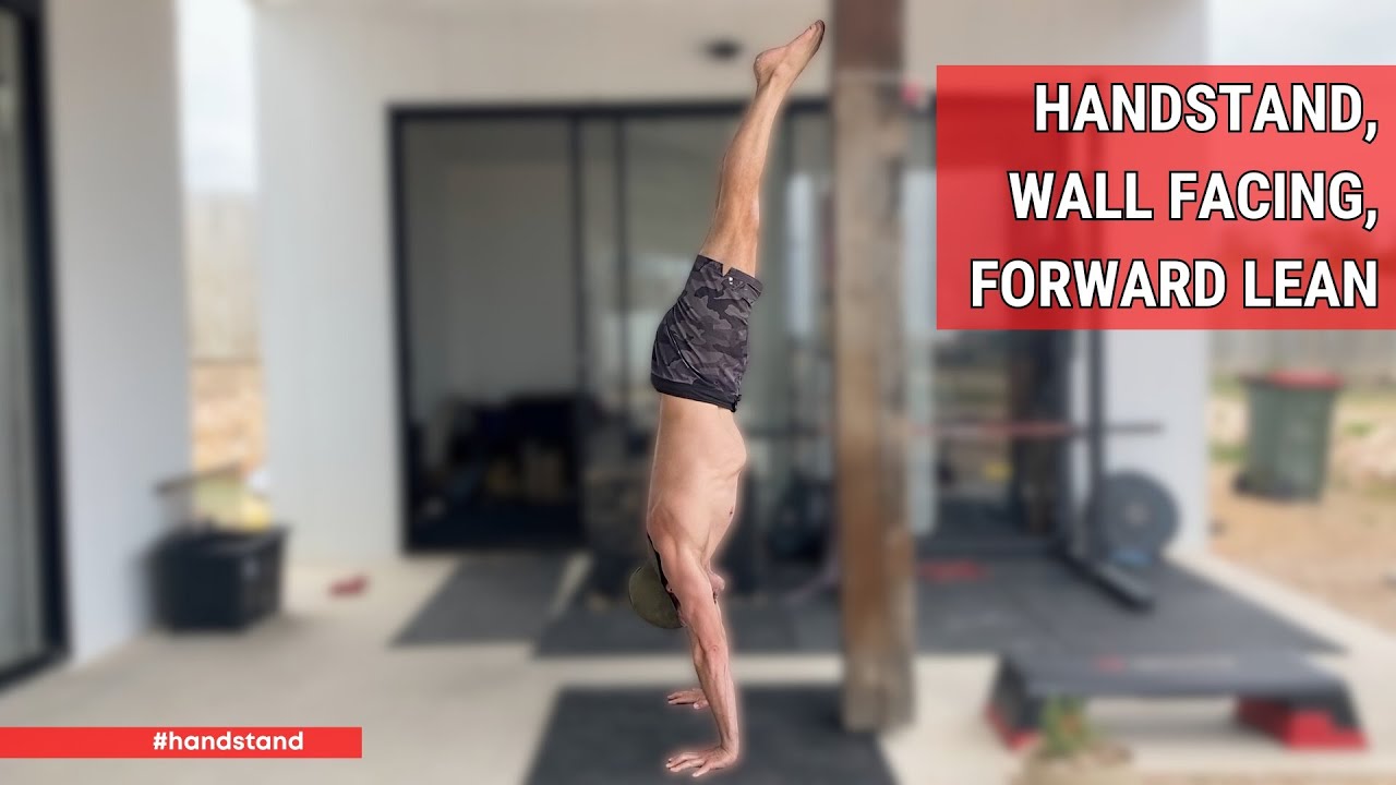 Стойка на руках, лицом к стене, наклон вперед
