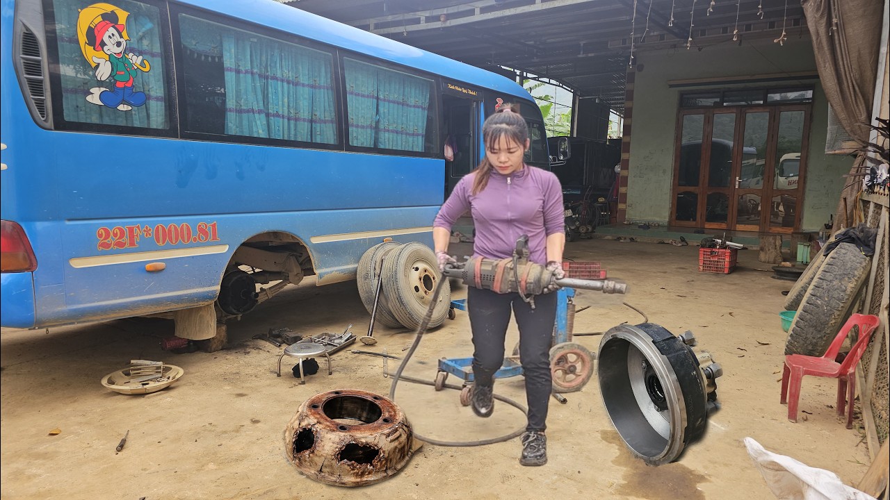 Female mechanic:replacing a severely damaged wheel hub and servicing the braking system on a passeng