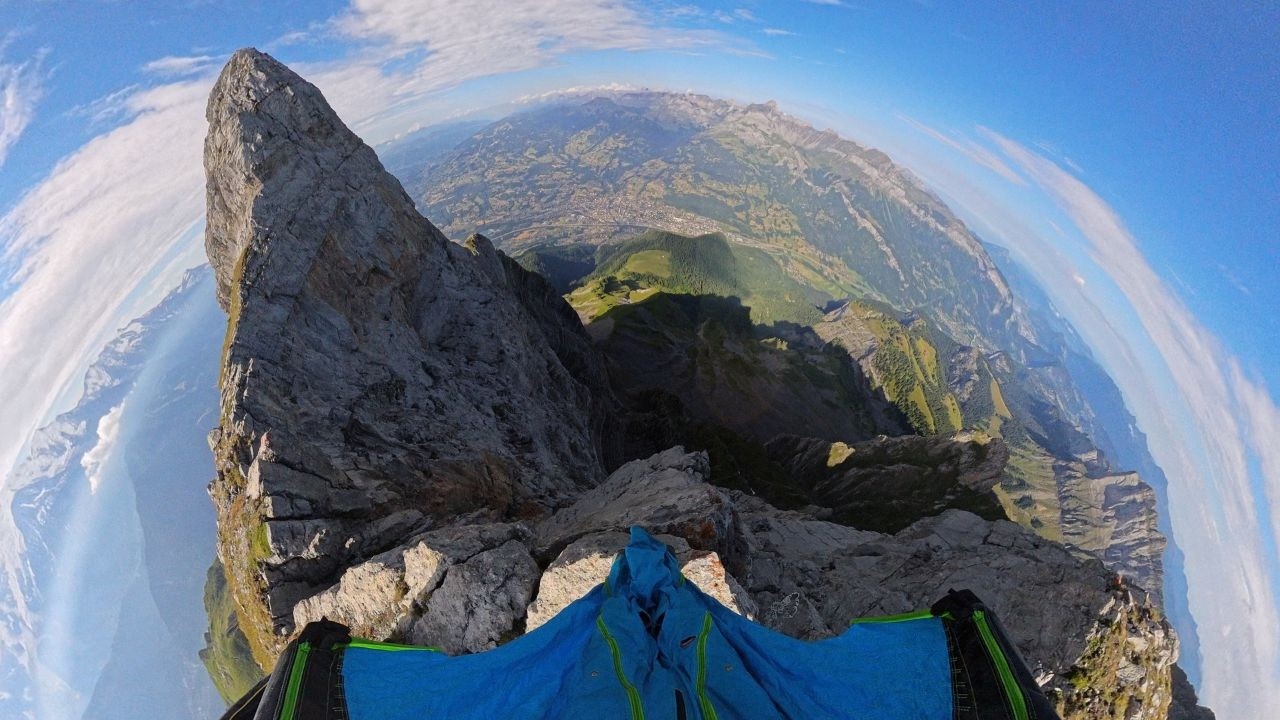 Wingsuit flying above peaks and valleys | Immersive 360 VR