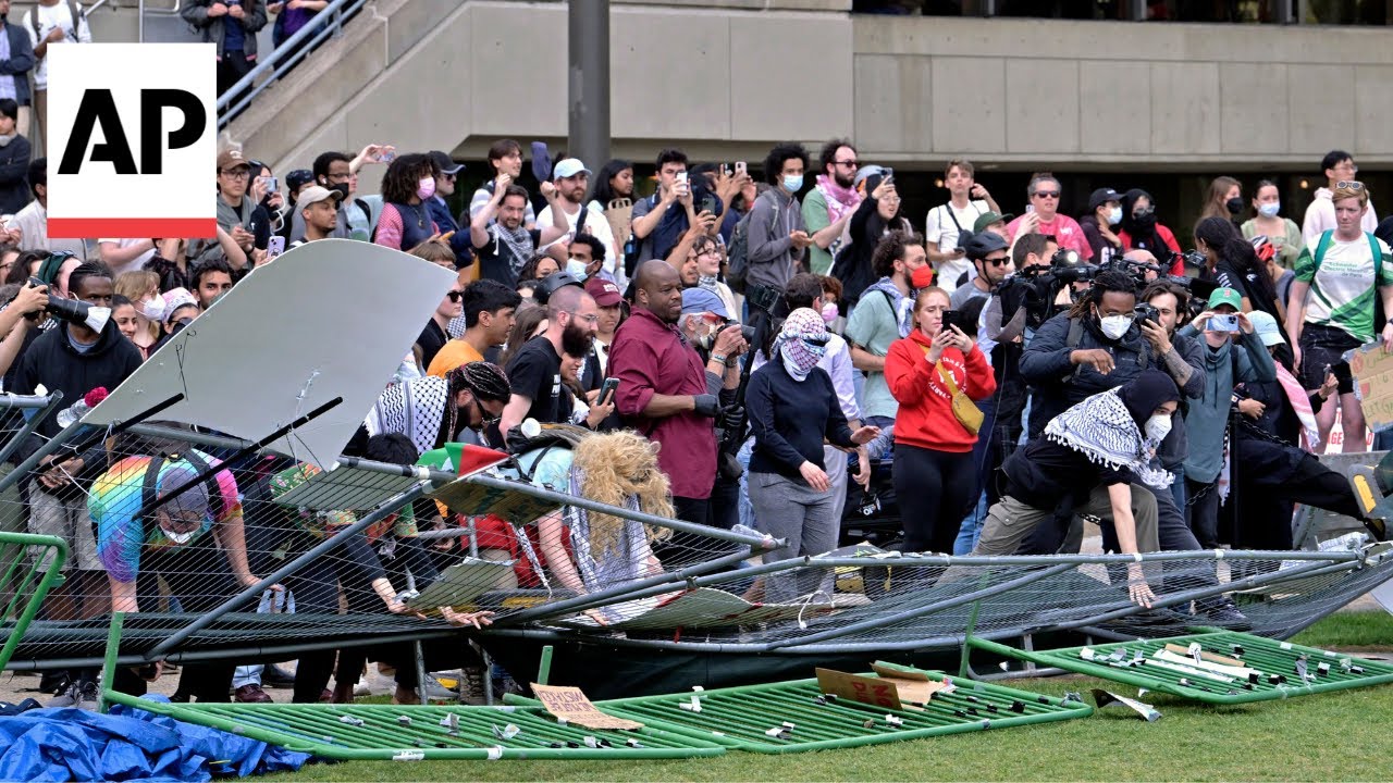 Pro-Palestinian protesters knock down barrier at MIT