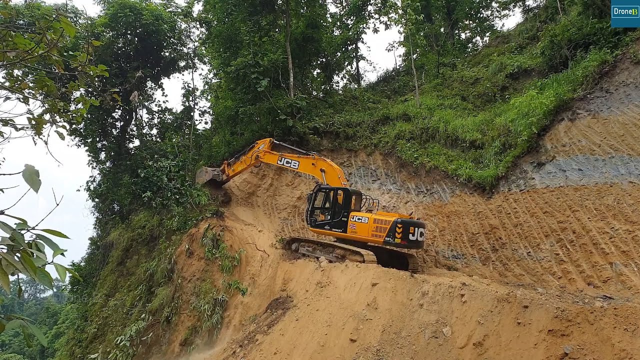Cutting Hillside for North-South Mountain Highway with JCB Excavator and Wheel Loader