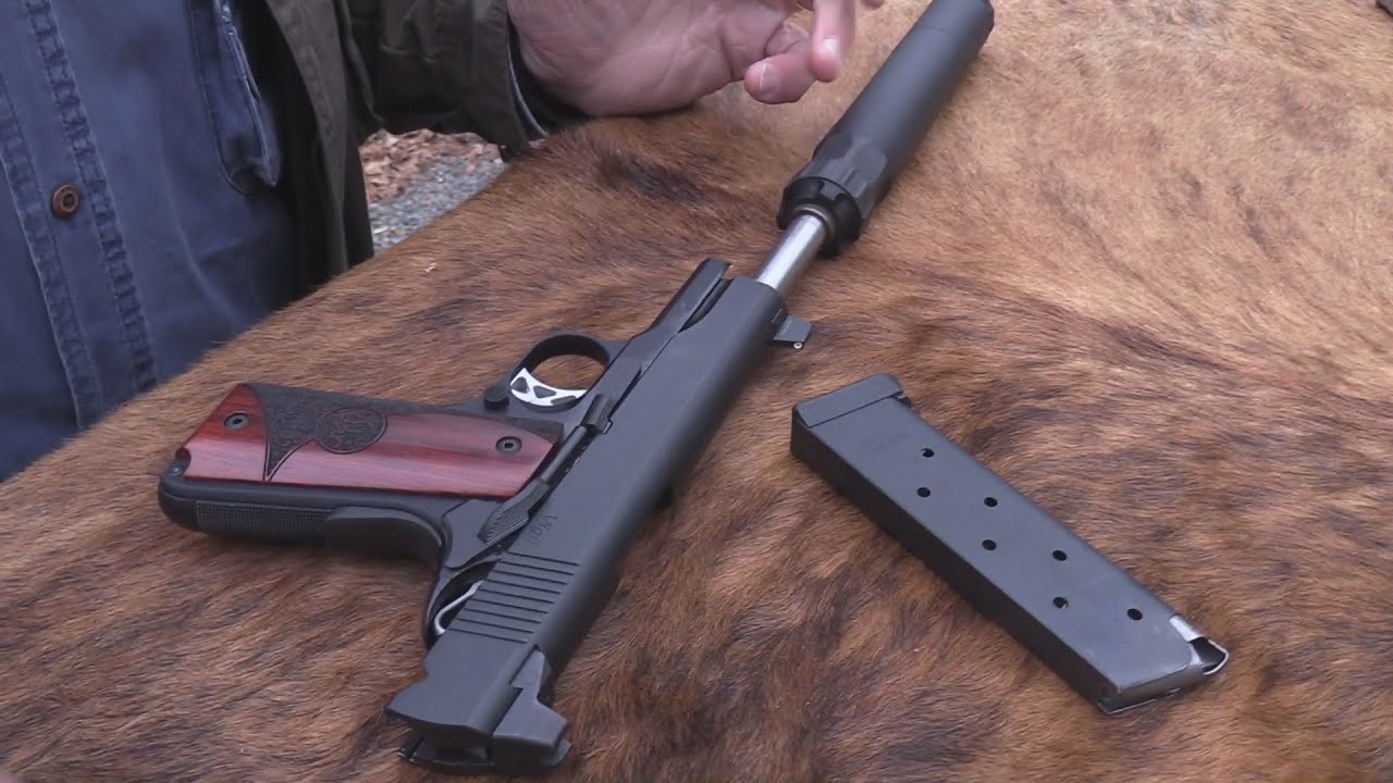 Пистолет Dan Wesson Vigil 1911 калибра .45 с глушителем.