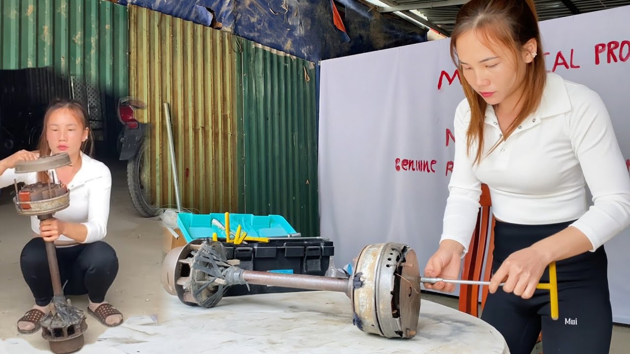 The girl repairs a hydroelectric generator in Vietnam during the 1990s.