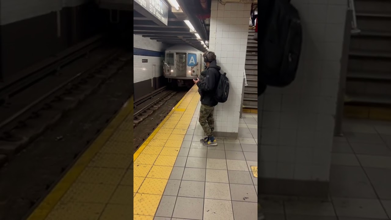 R42 garbage train stops at Roosevelt Av