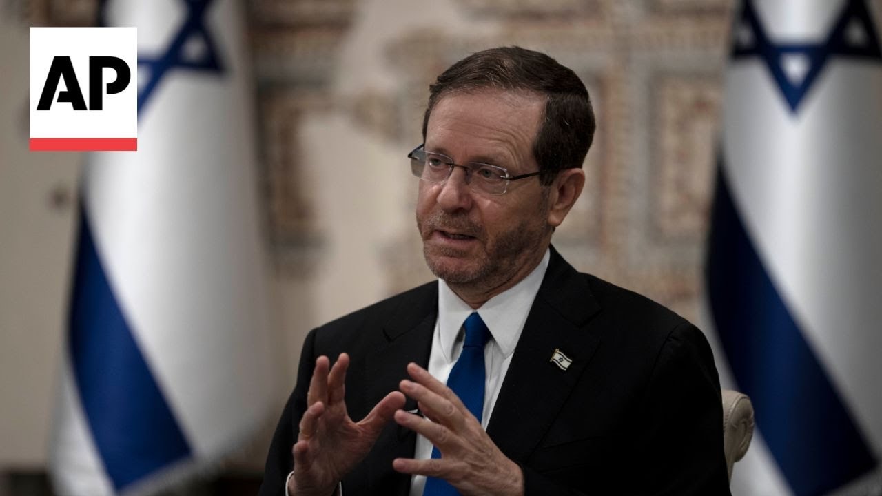 Israeli President Isaac Herzog reacts to Hezbollah launching over 100 rockets