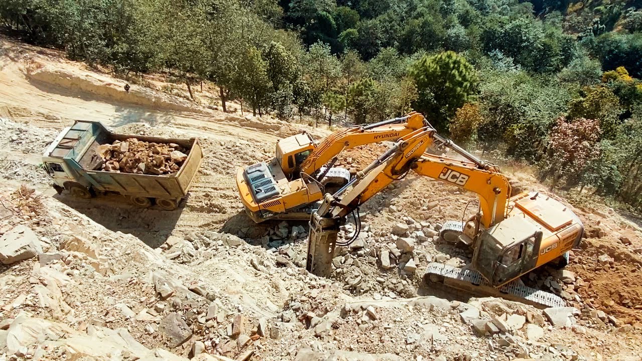 Excavators Loading Dump Trucks, Cutting Stones and Building Mountain Road