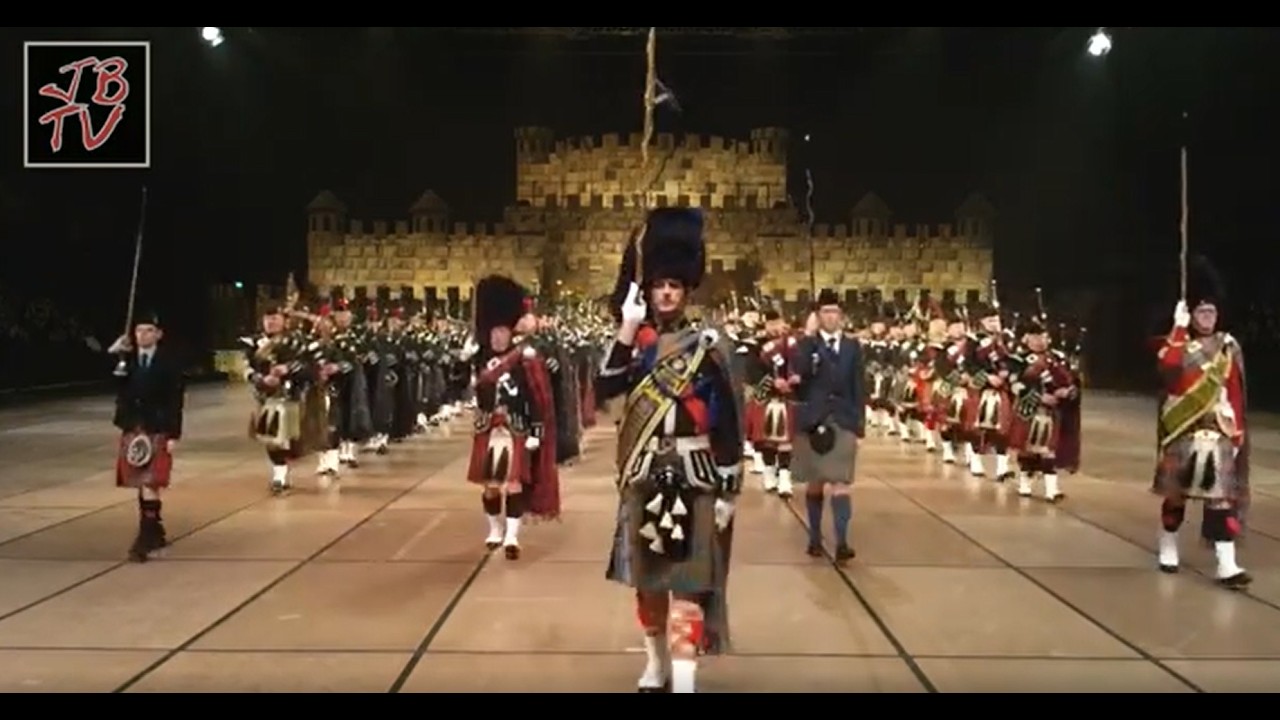Pipes and drums marching out of the Scottish Castle
