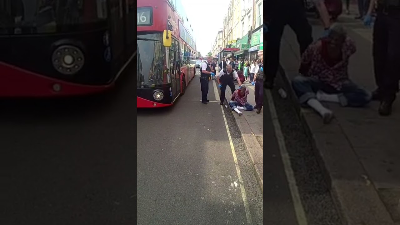 Kilburn London police what is happening posing with illegal migrant punishment for making noise
